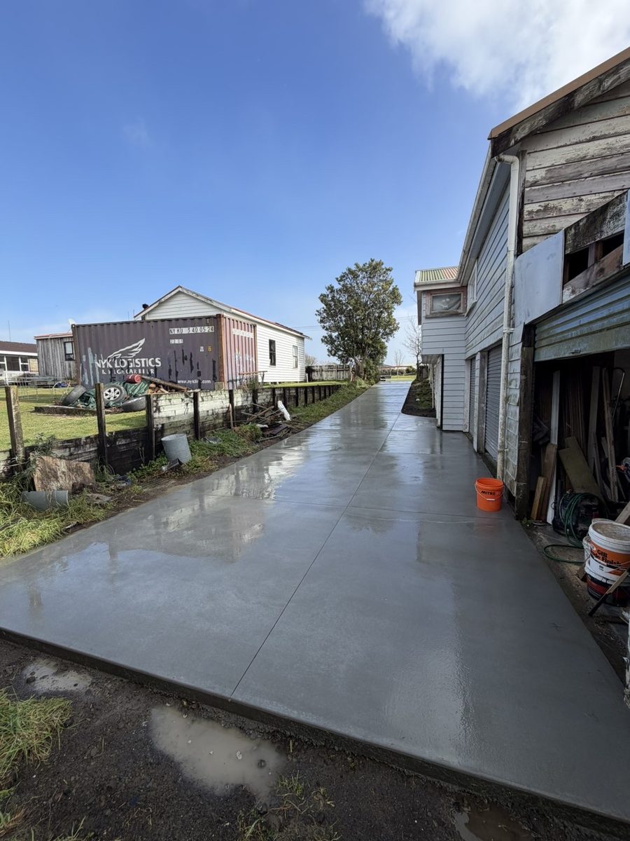 After: concrete driveway replacing a muddy grass track