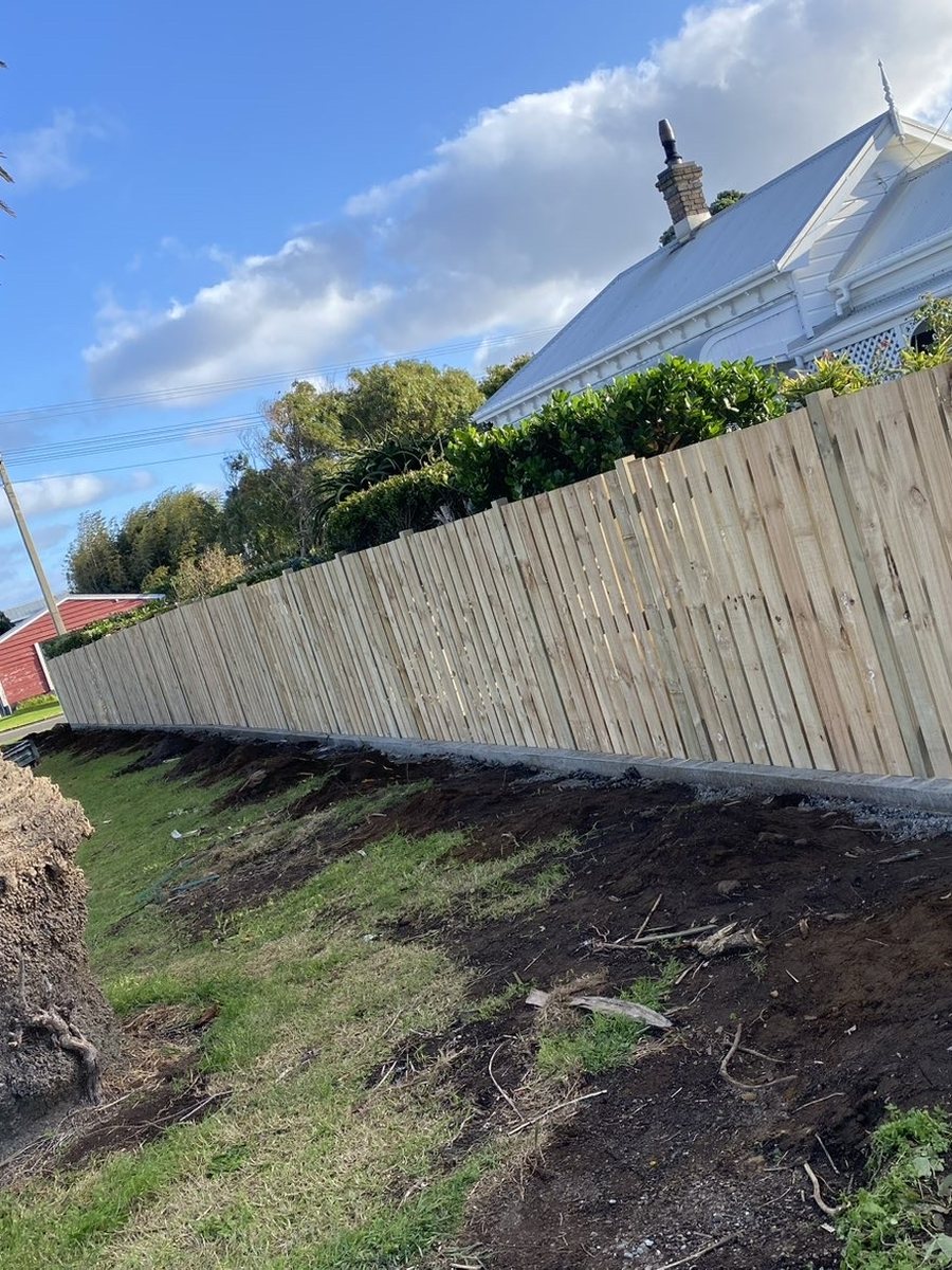 After: timber paling fence on the bare post and rail frame
