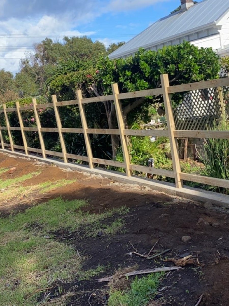 Before: timber paling fence on the bare post and rail frame